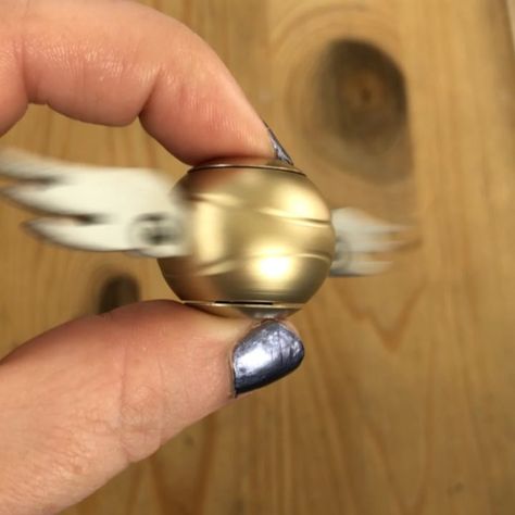 Golden snitch fidget spinner! #goldensnitch #fidgetspnner #harrypotter #quidditch #potterhead #harrypottershop Harry Potter Shop, Slytherin Harry Potter, Golden Snitch, Fidget Spinner, Harry Potter, Gemstone Rings, Silver Rings, Gemstones