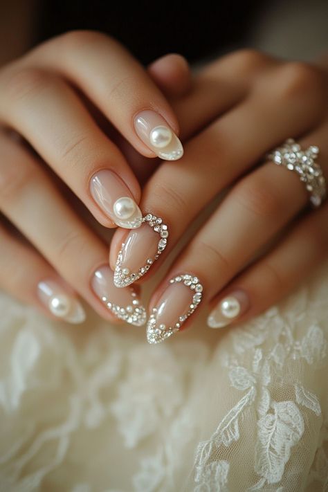 Wedding day manicure. french manicure with crystal tips and pearl accents.

First impressions last a lifetime - and that’s why every detail matters on your big day, especially when it comes to your nails. Presenting 39 mix of timeless classics and trendy bridal wedding nail art designs that promise to make your ring exchange even more photogenic. Whether you're all about…

Read more: https://tastywed.com/generated-post-39-creative-bridal-wedding-nail-art-designs-and-tips/ Wedding Nails Beach, Indian Bride Nail Art, Bridal Manicure Wedding Nails Ideas, Wedding Mani Pedi, Wedding Nail Art For Bride, Cathedral Wedding Ceremony, Wedding Nail Art Designs, Watercolor Wedding Cake, Crystal Tips