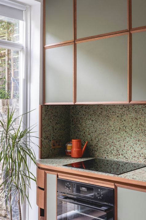 #kitchen #kitchendesign #terrazzo #terrazzocounter #woodcabinetry #paintedcabinetry $framedkitchen | photo: billy bolton Glasgow Apartment, Kitchen Terrazzo, Barcelona House, Muted Green, Student House, London Apartment, Small Space Solutions, Wood Detail, Custom Made Furniture