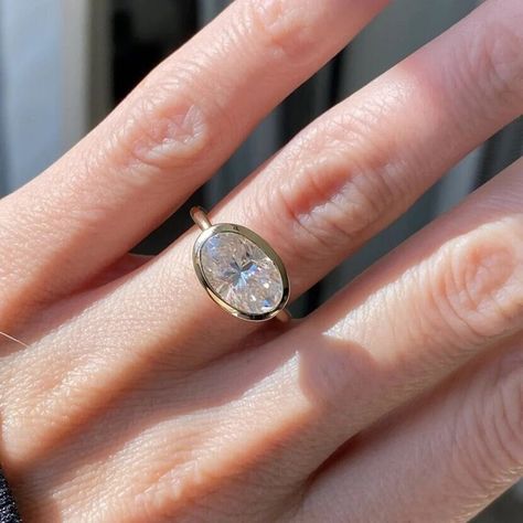 East To West Ring, Solitaire Ring, Bezel Set Wedding Ring, East To West Oval Cut Moissanite Engagement Ring, Unique Ring, 14k Solid Gold ●𝐃𝐞𝐬𝐜𝐫𝐢𝐩𝐭𝐢𝐨𝐧 𝐎𝐟 𝐃𝐢𝐚𝐦𝐨𝐧𝐝  ● Main Stone Details → Stone: Simulated Diamond/ Moissanite  → Stone Shape: Oval  ● Metal Details → Silver - 925 Sterling Silver → White Gold - 10KT/ 14KT/ 18KT → Yellow Gold - 10KT/ 14KT/ 18KT → Rose Gold - 10KT/ 14KT/ 18KT ● Size Customization: →What Size you want... You can also Customize ring size in US 4 to US 1 Bezel Set Wedding Ring, Oval Cut Moissanite Engagement Ring, Big Stone Ring, Bezel Engagement Ring, Bezel Set Ring, Ring Bezel, Wedding Rings Solitaire, Cvd Diamond, Etsy Gold Ring