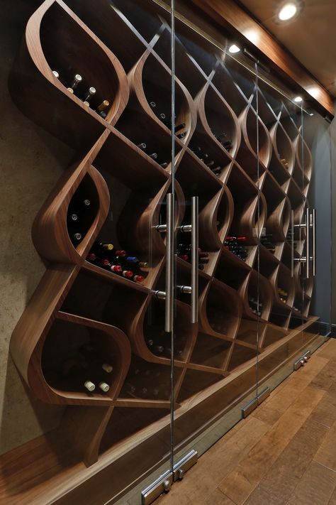 Unique wine storage designed and built by Genuwine Cellars. This wine cellar style is known as the Q Curve and holds approximately 380 bottles within curved wood wine racks. This one-of-a-kind Architectural Series wine wall concept features a precision-cr Wall Concept, Wine Closet, Home Wine Cellars, Custom Wine Cellars, Wine Cellar Design, Cellar Design, Wine Coolers, Wood Wine Racks, Wine Wall