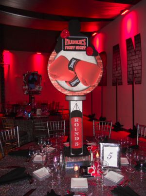 These centerpieces are a combination of signature collage style pieces and 3D elements. Both feature the brick wall feel (to represent the outside of a boxing gym) and then boxing gloves and a silhouette of a boxer. [Two different images are back to back.] www.partyexcellence.net Ufc Party, Boxing Theme Party Ideas, Boxing Party, Boxing Birthday, Wwe Birthday, Bat Mitzvah Themes, Mitzvah Themes, Boxer And Baby, 3d Elements