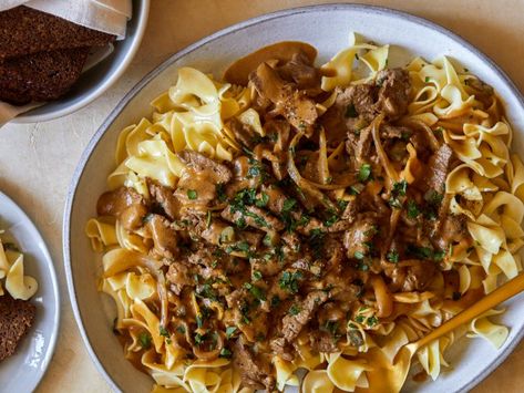 Beef Stroganoff Recipe | Rachael Ray | Food Network Beef Stroganoff Crockpot, Beef Stroganoff Easy, Buttered Noodles, Stroganoff Recipe, Sliced Meat, Rachel Ray, Beef Burgers, Beef Tenderloin, Beef Stroganoff