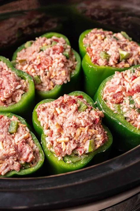 uncooked meat mixture shown stuffed into each green pepper in the slow cooker. Crock Pot Stuffed Peppers, Best Stuffed Pepper Recipe, Easy Stuffed Pepper Recipe, Beef Meatloaf Recipes, Green Pepper Recipes, Easy Dinner Desserts, Sausage Crockpot, Crockpot Stuffed Peppers, Pork Crockpot Recipes