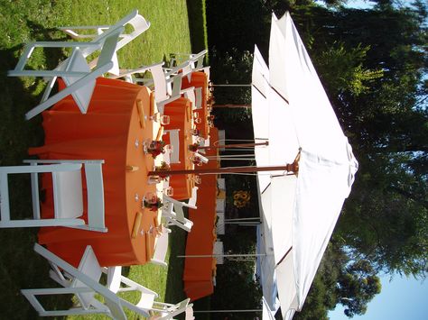 Orange table linens with umbrellas. Backyard Umbrella, Umbrella Party, Round Table Settings, Backyard Baby Showers, Graduation Dinner, Garden Party Theme, Orange Table, Garden Party Decorations, Umbrella Wedding