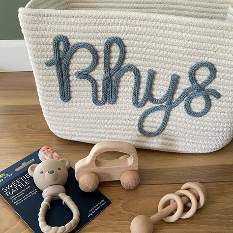 “Meaning:Ardent; Enthusiasm. Rhys is a masculine name of Welsh origin. This name, also historically used as a surname, has deep roots in Welsh culture. It can be traced back to Deheubarth, made famous by many Welsh kings and noblemen.” #rhys #babynames #pregnancyannouncement #genderreveal #babyshowergift #babygift #babynamesign #namebasket #personalizedbasket Rhys Name, Crochet Nursery Rhymes, Welsh Names Boys, Knitted Name Sign Diy, Welsh Culture, Personalised Baby Blanket Knitted, Deep Roots, Baby Name Signs, Shower Gifts