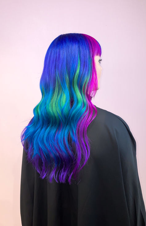 Vibrant Multicolor Cold Tones Hair 🌈❄️ Achieve a stunning, bold look with cool blues, purples, greens and pinks, using Herman's Amazing hair colors! Perfect for those who love unique, head-turning styles. 💜 Hair by: @kirahairdresser on instagram Multicolor Blue Hair, Blue Pink Hair, Vibrant Hair Color, Blue And Pink Hair, Vibrant Hair, Amazing Hair, Tone Hair, Cool Hair Color, Blue Ombre