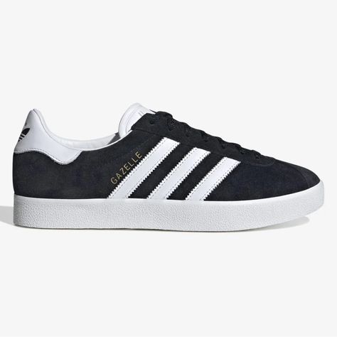 The Adidas Gazelle Has Been A Staple In The Footwear Game Ever Since Its Original Release In The 60s, Followed By Its Re-Release In The 80s. The Gazelle 85 Arrives In An Eye-Catching "Black/White/Gold" Colourway, Combining A Simple Yet Effective Look With Og Elements Such As The Gold Coloured Branding Next To The Iconic 3-Stripes. - Adidas Gazelle 85 Black/White/Gold - Suede Upper - Leather Lining - Lace Closure - Rubber Outsole Brand New In Box. Product Details Article No. Ie2166 Color Black/Wh Adidas Gazelle Black And White, Adidas Gazelle Black, Adidas Originals Shoes, Adidas Shoes Originals, Adidas Originals Gazelle, Black White Gold, Shoes Brand, The 60s, Adidas Gazelle