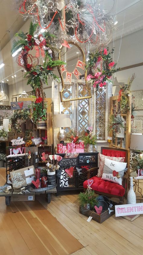 Valentines day decor display idea. Colorful vintage chair accents the theme well. @magnoliasne Valentine Store Window Display, Valentines Store Display, Valentines Booth Ideas, Valentine Booth Display Ideas, Valentines Display Ideas, Valentine Display Ideas Retail, Valentine Window Display Ideas, Valentines Booth, Storefront Ideas