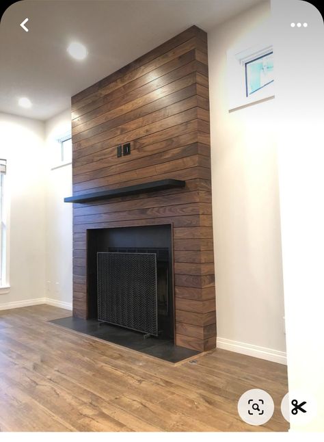 Wood Stain Shiplap Fireplace, Brown Shiplap Fireplace, Stained Wood Shiplap Fireplace, Stained Shiplap Fireplace Wall, Black Fireplace Wood Paneling, Wood Shiplap Fireplace Wall, Barn Wood Fireplace Wall, Wood Wrapped Fireplace, Stained Wood Fireplace Surround