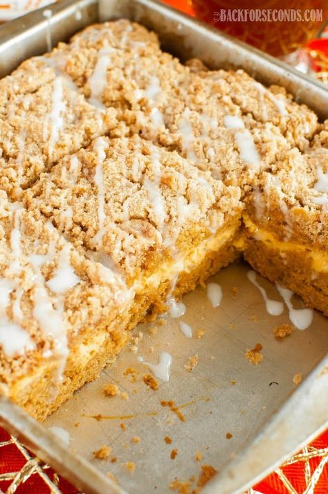 Pumpkin Cream Cheese Coffee Cake with Streusel is the ultimate fall recipe. This pumpkin spiced cake is great for holidays, breakfast, brunch, or dessert! Pumpkin Cream Cheese Coffee Cake Recipes, Pumpkin Coffee Cake With Cream Cheese, Pumpkin Cheesecake Coffee Cake, Pumpkin Cream Cheese Coffee Cake, Pumpkin Strudel Coffee Cake, Pumpkin Desserts With Cream Cheese, Coffee Cake With Cream Cheese, Pumpkin Streusel Coffee Cake, Cream Cheese Pumpkin