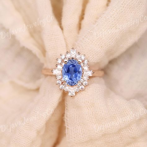 Exquisite Vintage Oval Cornflower Blue Sapphire Engagement Ring in Rose Gold, Accented with Alternating Baguette and Round Moissanite Stones in a Halo Design. This Art Deco-Inspired Bridal Ring is a One-of-a-Kind Sapphire Boho Ring, Perfect for Anniversaries or as a Baby Blue Accessory for a Touch of Vintage Elegance. ✦ Handmade, high-quality item ✦ Material: SOLID 10K/14K/18K GOLD ( can be made in yellow/white/rose gold ) ✦Engagement ring ✦ Center stone: Lab sapphire  ✦ Size/Weight: 5*7mm ✦ Col Vintage Sapphire Engagement Rings, Sapphire Engagement Ring Vintage, Oval Sapphire Engagement Ring, Cornflower Blue Sapphire, Halo Art, Rose Gold Engagement Ring Vintage, Blue Sapphire Engagement Ring, Vintage Engagement Rings Sapphire, Sapphire Wedding Band