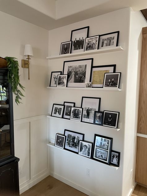 Ways To Display Diplomas Wall Ideas, Asymmetrical Picture Wall, Pictures In Corner Of Wall, Photo Wall Collage Corner, Layered Picture Frames On Shelf, Corner Wall Decorating Ideas, Wall Picture Collage Ideas, Stairway Decor Ideas, Family Photos Wall