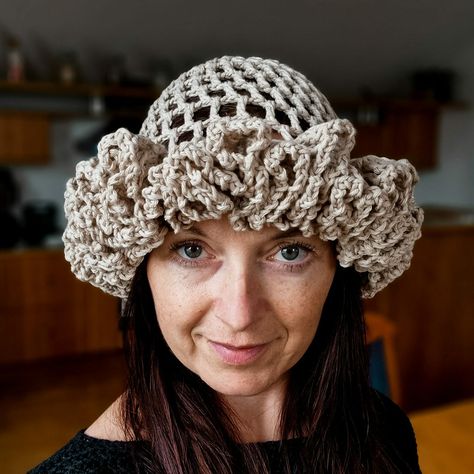 Discover the Grand Ruffle Brim Hat Pattern, a perfect crochet project to make a stylish statement this summer. Crafted with airy treble stitches and a dramatic ruffled brim, this hat pairs elegance with sun protection. Crochet Brim Hat Free Pattern, Crochet Ruffles Pattern, Crochet Ruffle Hat Free Pattern, How To Make Ruffles, Crochet Ruffle Hat, Ruffles Pattern, Ruffle Hat, Crochet Hat With Brim, Ravelry Crochet