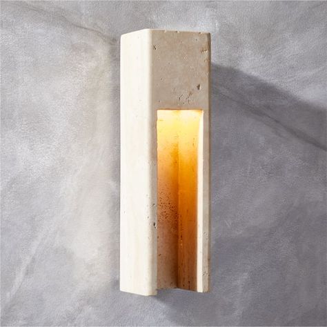 Studio Anansi's indoor/outdoor wall sconce is carved from a single piece of travertine for a clean, uncomplicated design that softly scatters light. Lightly polished to unify its tone, each sconce will have subtle differences that render it uniquely beautiful. CB2 exclusive.  -Designed by Studio Anansi -Travertine -Polished stainless steel canopy -Variation in color and activity of travertine is to be expected; each will be unique -Indoor/outdoor -Accommodates one 40W E12 bulb or 5W LED bulb not Travertine Wall, Wall Scone, Steel Canopy, Modern Outdoor Lighting, Exterior Wall Light, Outdoor Floor Lamps, Outdoor Sconces, Modern Wall Sconces, Modern Light Fixtures