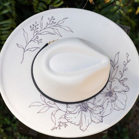 Hand Burned Cream Festival Hat - Felt Wide Brim Rancher Hat Pyrography Wedding Maternity Beach Bachelorette Cowboy Floral Flowers

This gorgeous hand burned rancher hat is PERFECT for a day with your favorite hoofed friend or that festival you've been planning for all year!
Each design is drawn and then burned by hand with a wood burner.

It's all man made materials (polyester) with a black band and gold chain. Size is adjustable and measures approximately 23 inches at its largest. Black Burned Felt Hat, Burning Hats Diy, Burnt Hat Design, Hat Pyrography, Pyrography Hats, Felt Hat Burning Designs, Burned Felt Hat, Hat Burning Ideas, Burning Hats