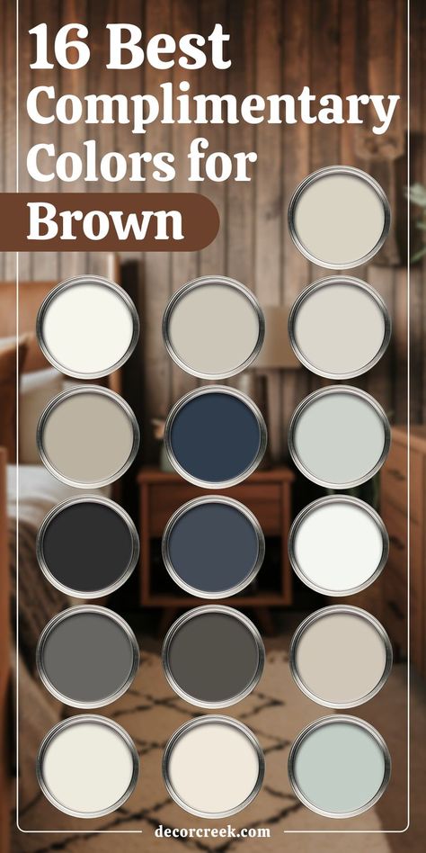 This image displays the title "16 Best Complimentary Colors for Brown" with sixteen unlabeled paint swatches arranged in a grid. The swatches showcase a variety of complementary colors, including shades of white, beige, gray, navy blue, soft green, and taupe, all designed to pair well with brown tones.

The background features a cozy room with warm brown wood paneling, a bed, a nightstand with a lamp, and a neutral area rug. The setting has a warm and inviting atmosphere. Sherwin Williams Western Paint Colors, Complimentary Colors For Brown, Colors That Go With Dark Brown, Complimentary Paint Colors, Western Paint Colors, Brown Interior Paint, Tricorn Black, Brown Paint Colors, Edgecomb Gray