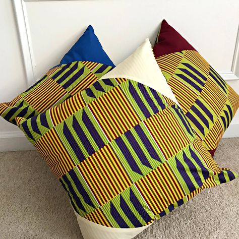 "These bold and beautiful African print pillow will be the perfect complement to your couch and the focal point in any room in your home or office. Great housewarming gift, wedding gift or home decorations. Material: Kente African fabric Size: 17.5\" x 17.5\" / 43 cm x 43 cm Note: This is only pillow covers. No stuffing comes with them.  Matching curtains and placemats available in store. Sold separately." African Throw Pillows, African Print Pillows, African Pillow, Kente Fabric, Fabric Pillows, African Inspired Decor, African Interior, Ethnic Home Decor, African Home Decor