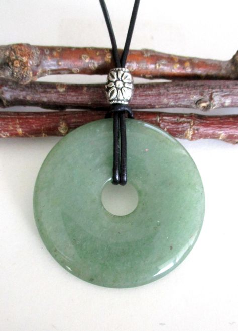 "Green Aventurine Natural Semi-Precious Gemstone Donut Shape Energy Pendant Necklace.  ED598 / ED598-A -50mm / ED637-40mm / ED302-30mm ED598 - Measures approx. 50 x 8mm = 2\" x ¼\".    ED598-A - Measures approx. 50 x 8mm = 2\" x ¼\".  Has small natural markings. ED637 - Measures approx. 40 x 7mm = 1 ½\" x ¼\".  Suspended on a continuous 31\" black leather cord strand without a clasp closure and accented with a silver tone Tibetan style bead. ED302 - Pendant measures approx. 30 x 7mm = 1 ¼\" x ¼\ Donut Pendant Necklace, Green Donut, Donut Necklace, Music Academy, Random Clothes, Donut Pendant, Green Aventurine Crystal, Aventurine Crystal, Donut Shape