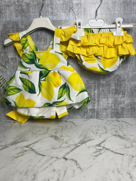 "Made in Italy- This 2 piece set will make any baby overload with cuteness! Elevate your baby's wardrobe with our charming \"Lemon Frills\" 2 Piece Set, meticulously made in Italy. Drawing inspiration from the vibrant lemon groves of the Amalfi Coast, this set features a delightful lemon print that adds a touch of sunny whimsy to your little one's attire" Lemon Outfit, Italy Drawing, Lemon Grove, Mediterranean Design, The Amalfi Coast, Lemon Print, Girl Fits, Girls Clothing Sets, Clothing Sets