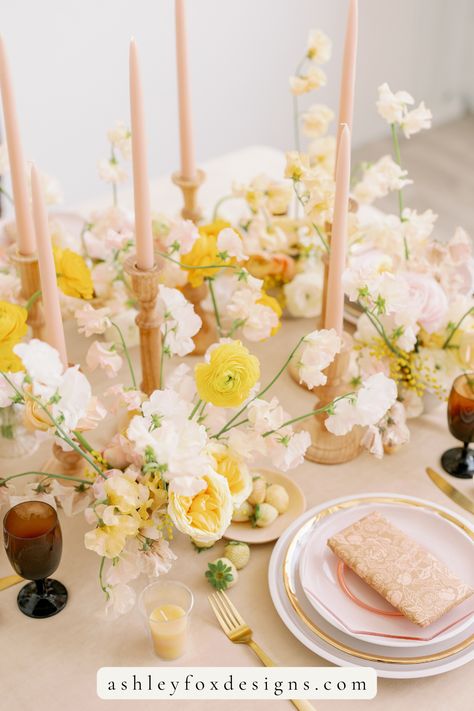 A wedding tablescape featuring hues of pink and yellow throughout the floral arrangments, table settings and candlesticks. To see more from this gallery including the initial creative direction styling deck, head to the link in the pin! #creativestyling #weddingdesign #weddingtablescape #weddingfloral Peach And Yellow Wedding, Yellow And Pink Wedding, Pale Yellow Weddings, Pink Yellow Weddings, Pink And Yellow Wedding, Budapest Wedding, Flower Curtains, Pink Table Settings, Pink Tablescape