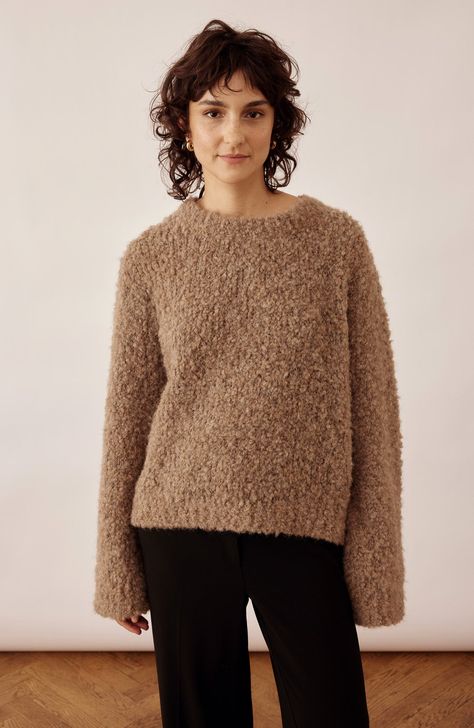 This knitted bouclé sweater made of 100% alpaca is designed to keep you warm in style for many years to come. With its comfortable round neckline, this versatile piece is perfect for layering or wearing on its own. Designed for a relaxed fit, yet with a feminine touch with its fashionable wide sleeves. Embrace Moa as an autumn must-have, offering both comfort and effortless style. Boucle Knit, Boucle Sweater, Scandinavian Minimalism, Jackets Jeans, Sweater Making, Knit Fashion, Wide Sleeves, Seasonal Fashion, Fashion Essentials