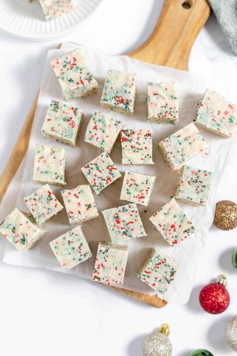 This Christmas Sugar Cookie Fudge recipe combines the taste of Christmas sugar cookies with creamy white chocolate fudge and Christmas sprinkles! It's the perfect sweet treat for Christmas parties or cookie exchanges, and makes a great edible gift! Sugar Cookie Fudge Recipe, Christmas Sugar Cookie Fudge, Cookie Fudge Recipe, Sugar Cookie Fudge, Peppermint Bark Fudge, Cookie Fudge, White Fudge, Chocolate Walnut Fudge, Christmas Sugar Cookie