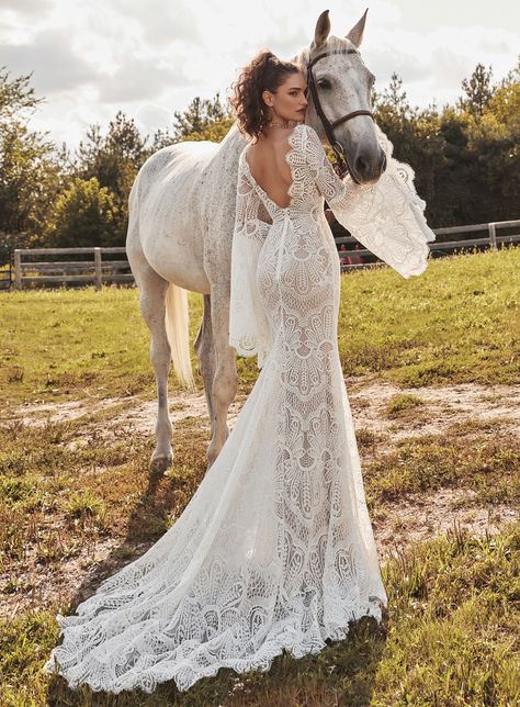 “Rhiannon rings like a bell through the night.” Inspired by bold bohemian beauty- this visually stunning sheath lace wedding dress features a dreamy sweetheart neckline, a sexy scooped back and dramatic bell sleeves which provide a stunning focal point. The perfect dress for twirling under the stars. Mermaid Boho Wedding Dress, Bell Sleeve Wedding Dress, Casual Wedding Guest Dresses, Sheath Wedding Gown, Bohemian Wedding Dress Lace, Western Wedding Dresses, Beach Wedding Guest Dress, Black Tie Wedding Guests, Boda Mexicana