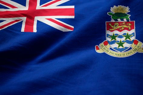 Closeup of ruffled cayman islands flag, cayman islands flag blowing in wind Photo | Premium Download Cayman Islands Flag, Grand Cayman Island, Cayman Island, Vintage Hawaii, Grand Cayman, Hawaii Beaches, Beach Hotels, Spain Travel, Vintage Travel Posters