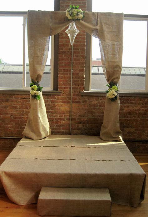 Ceremony platform & Arch covered in burlap Rug At Alter Wedding, Wedding Arch With Rug, Straw Bale Wedding Backdrop, Wedding Arch With Burlap, Vintage Rug Wedding Ceremony, Jute Rug Aisle Runner Wedding, Ceremony Platform, Relationship Things, Events Decor