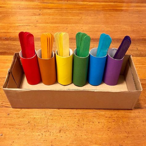 Bea ❤️ on Instagram: “🌈Here’s a simple colour sorting activity using tp rolls, cardboard box, coloured paper and large coloured popsicle sticks.🌈 . To make this,…” R Activity, Color Sorting Activities, Montessori Toddler Activities, Coloured Paper, Baby Learning Activities, Daycare Activities, Sorting Activities, Color Sorting, Montessori Toddler