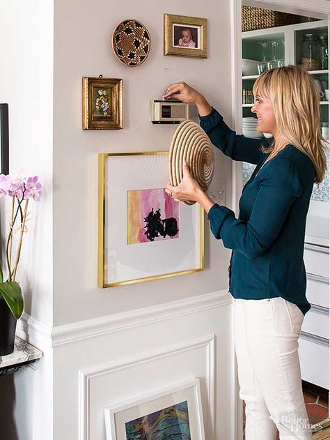 Spring Cleaning Guide Nice gallery wall great idea to hide thermostat with basket Hide Thermostat, Spring Cleaning Guide, Room Cleaning Tips, Thermostat Cover, Doorbell Cover, Hiding Ugly, Exterior Light Fixtures, Spring Cleaning Checklist, Spring Cleaning Hacks