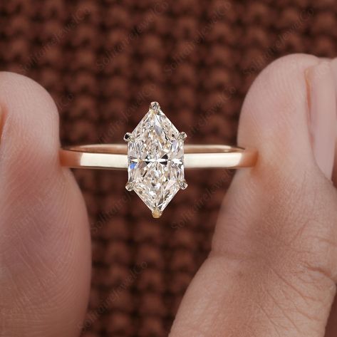 This stunning lab-grown diamond solitaire engagement ring features a mesmerizing Dutch Marquise cut, certified by IGI for its exceptional quality. The elegant design showcases the brilliance and clarity of the lab-grown diamond, making it a timeless piece for any occasion. Available in 10K, 14K, and 18K gold options, you can select from rose gold, yellow gold and white gold.  It is an ideal gift for a wedding anniversary, symbolizing enduring love and commitment.  Lab diamonds, also referred to as lab-grown diamonds, CVD diamonds, HPHT diamonds, Green diamonds, Eco-friendly Diamonds, Ethical Diamonds, Earth-friendly diamonds, or Man-made diamonds, offer a sustainable and ethical alternative to traditional diamonds. ● 𝐃𝐢𝐚𝐦𝐨𝐧𝐝 𝐃𝐞𝐭𝐚𝐢𝐥𝐬: ● 𝐌𝐚𝐢𝐧 𝐃𝐢𝐚𝐦𝐨𝐧𝐝 𝐃𝐞𝐭𝐚𝐢𝐥𝐬 ➢ Marquise Solitaire Engagement Ring, Dutch Marquise, Ethical Diamonds, Marquise Solitaire, Green Diamonds, Diamond Ring For Women, Traditional Diamond, Cvd Diamond, Man Made Diamonds