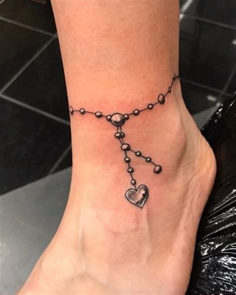 charm bracelet tattoo designs - Yahoo Search Results Ankle Tattoos For Women Anklet, Ankle Bracelets Tattoos For Women, Charm Anklet Tattoo, Ankle Bracelet Tattoos, Bracelet Tattoo Ideas, Anklet Tattoos For Women, Charm Bracelet Tattoo, Bracelet Tattoos, Wrist Bracelet Tattoo