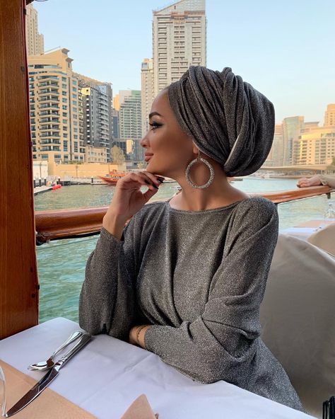 Image may contain: 1 person, sitting, table and outdoor Turban Outfit, Hijab Turban Style, Headwrap Hairstyles, Estilo Hijab, Turban Hijab, Head Wrap Styles, Hair Wrap Scarf, Hair Scarf Styles, Mode Turban