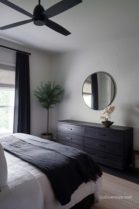 For a fresh and organic feel in your personal space, especially one with tons of black features, incorporate more natural elements like a small tree in your bedroom!