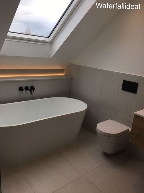 Bathroom With Velux Window, Eaves Bathroom Slanted Ceiling, Slanted Roof Bathroom Ideas, Bath In Front Of Window, Bathroom With Slanted Ceiling, Eaves Bathroom, Sloped Ceiling Bathroom, Small Attic Bathroom, Outdoor Bathtub