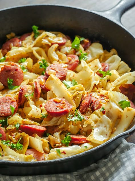 Fried Cabbage and Polish Kielbasa Skillet: The stars of this dish are kielbasa – always a fave – and cabbage. The cabbage softens without losing all it’s crunch, and the other ingredients (garlic, onion, white wine vinegar, Dijon mustard and paprika) have a chance to blend together and make a great backdrop for the first two show-runners. Cabbage And Kielbasa, Kielbasa Skillet, Kielbasa And Cabbage, Cabbage Dishes, Kielbasa Recipes, Cabbage And Sausage, Kielbasa Sausage, Fried Cabbage, Skillet Dinners