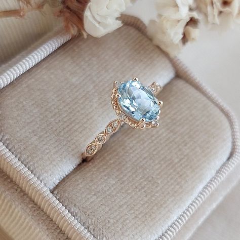 This ring, which you can choose as an engagement ring or a marriage proposal ring, is made in vintage style with ice blue aquamarine stones and diamonds. It will take you on a journey to Victorian times and feel the spirit of the times. Aquamarine & Diamond Vintage Design Ring ✰ Diamonds: 0.10 Carat ✰ Diamonds Clarity: SI F ✰ Aquamarine: 1.10 Carat ✰ 14K Solid Gold  ✰ Rose Gold | White Gold | Yellow Gold ✰ You can choose gold color of rings. ✰ Aquamarine and diamond stones are 100% natural. ✰ Or Sapphire Aquamarine Ring, Blue Engagement Ring Vintage, Light Blue Topaz Engagement Ring, Light Blue Diamond Engagement Ring, Blue Ring Engagement, Blue Zircon Engagement Ring, Pearl And Sapphire Ring, Engagement Rings Topaz, Light Blue Wedding Ring