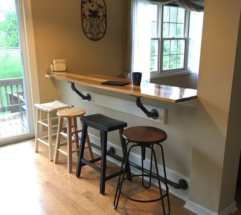 My bar on the half wall. Hickory Bar Top with galvanized pipe supports and foot rail. Mismatched stools. Kitchen Bar Window, Half Wall Kitchen, Bar Table Diy, Bar Window, Breakfast Bar Table, Pony Wall, Half Walls, Breakfast Bar Kitchen, Trendy Kitchen