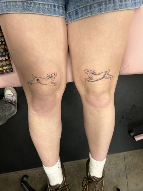 Two Bunny knee Tattoo Black Ink Asymmetrical Knee Tattoo Symmetrical, Nastolgia Tattoo, Matching Above Knee Tattoo, Tattoo Behind Knee, Tattoo Under Knee Woman, Double Knee Tattoo, Word Knee Tattoos, Symmetrical Knee Tattoos, Tattoos Above Knee