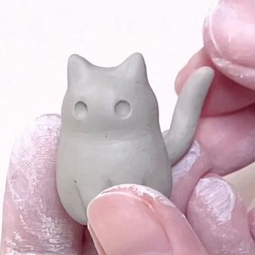 Tham Nguyen on Instagram: "My behind the scene sculpting black cat with ghost mask 🐈‍⬛👻. I love making my cats extra round. It was very time consuming to set up a good angle for my tiny cats but I’m happy with the result 😸💕 #blackcatart #catartwork" Clay Cat Step By Step, Ceramic Cats Sculpture Clay, Cat Made Out Of Clay, How To Make A Clay Cat, Mini Clay Cat, Air Dry Clay Cats, Cat Air Dry Clay, Cat Clay Ideas, Cat Ceramic Ideas