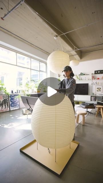 Keith Tio on Instagram: "Unboxing the Akari 21N, one of the largest (by volume) standing Akari lamps. The bulbous 21N was created in 1968 alongside its teardrop-shaped sister, the 23N (displayed in the back left corner) by Isamu Noguchi. Since the Akari series’ inception in 1951, the Akari lamps have been  handmade in Japan of washi paper and bamboo ribbing by original lantern makers Ozeki & Co., Ltd. (est. 1891).

My smart light system setup can be viewed via my Amazon storefront (affiliate link in bio).

.
.
.
#apartmenttherapy #homeinspo #interiordesign #isamunoguchi #noguchimuseum #ozeki" Akari Lamp, Light System, Isamu Noguchi, Amazon Storefront, Washi Paper, Smart Lighting, Inception, Lighting System, Apartment Therapy