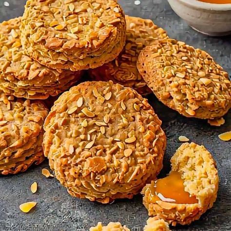 While at the restaurant, we sampled the well-known Australian Anzac Biscuits, a recipe that results in a biscuit with a golden-brown color and a firm, slightly chewy texture. Each biscuit had a flat, round shape Australian Recipes, Anzac Biscuits, At The Restaurant, Australian Food, Biscuits Recipe, Old Fashioned Recipes, Golden Syrup, Shredded Coconut, Biscuit Recipe