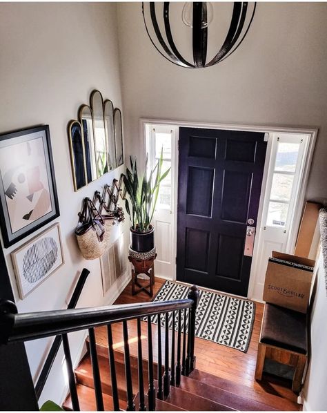 View from the top of the stairs to the front door Scandi Hallway, Split Foyer Remodel, Moody House, Split Entry Remodel, Moody Home, Interior Front Door, Home Entryway, Top Of The Stairs, Navy Walls