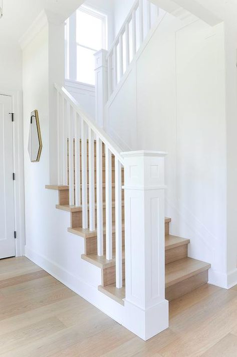 A white wooden staircase newel complements white posts and a white wooden handrail finishing a staircase with oak treads. White Stair Railing, Wooden Staircase Railing, Wooden Handrail, Baddie Bedroom, White Staircase, Wooden Staircase, White Stairs, Staircase Railing Design, Staircase Handrail