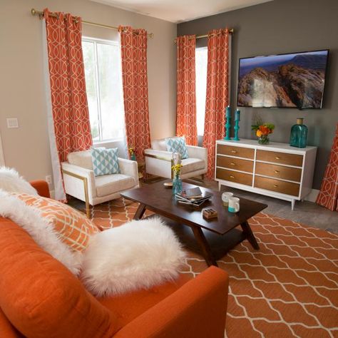 Orange And White Living Room Decor, Orange And Silver Living Room Decor, Brown And Orange Living Room Ideas Decor, Orange And Gray Living Room, Orange Living Rooms, Orange Apartment Decor, Living Room Decor Orange And Grey, Living Room Orange Accents, Curtains To Go With Orange Sofa