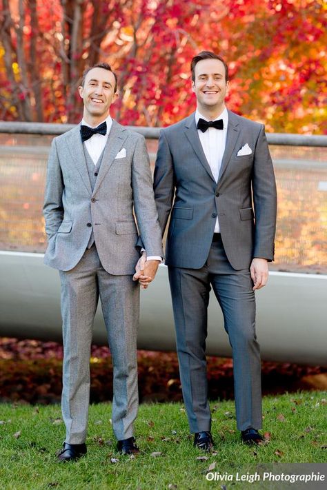 The grooms wore black bow ties with grey suits. Bow ties for $19 at www.TheTieBar.com | Photo Credit: Olivia Leigh Photographie Grey Suit With Bow Tie, Grey Suit Bow Tie, Gay Wedding Photography, Groom Suit Grey, Bow Tie Suit, Grey Suits, Dark Gray Suit, Gay Weddings, Grey Bow Tie