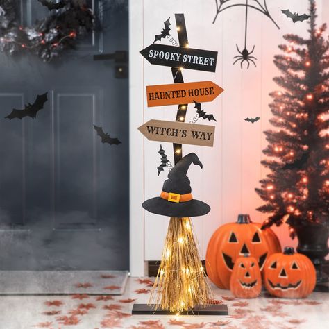 PRICES MAY VARY. Quality Craftsmanship & Original Design: This Halloween porch decor is handcrafted. The broom is made of raffia broom and warm lights are over around Size: Wooden porch sign measures 13.58”L×3.9”W×41.65”H, weighs 3.42 lbs. Comes with a wood base for stability Unique Design:This witch broom with bat is a special yard sign. Warm lights are over around the broom to add festive touch to your Halloween Lighted Halloween Decor: Our Halloween Decor has 20 bulbs with warm white light (2 Halloween Yard Signs, Halloween Office, Farmhouse Halloween, Adornos Halloween, Halloween Prop, Halloween Crafts Decorations, Halloween Tattoo, Witches Hat, Halloween Yard Decorations