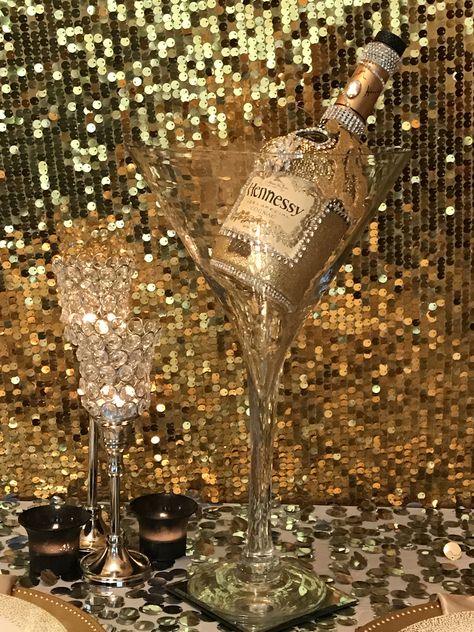 Hennessy bottle centerpiece Hennessy Party Ideas Decor, Hennessy Party, Hennessy Bottle, Bedazzled Liquor Bottles, 50th Birthday Party Ideas For Men, Decorated Liquor Bottles, 50th Birthday Party Decorations, Bottle Centerpieces, Diy Wine Glasses